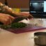 Knife chopping parsley at a cooking class