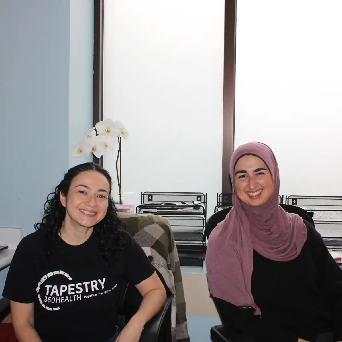 Two Tapestry employees in their office Two Tapestry employees in their office
